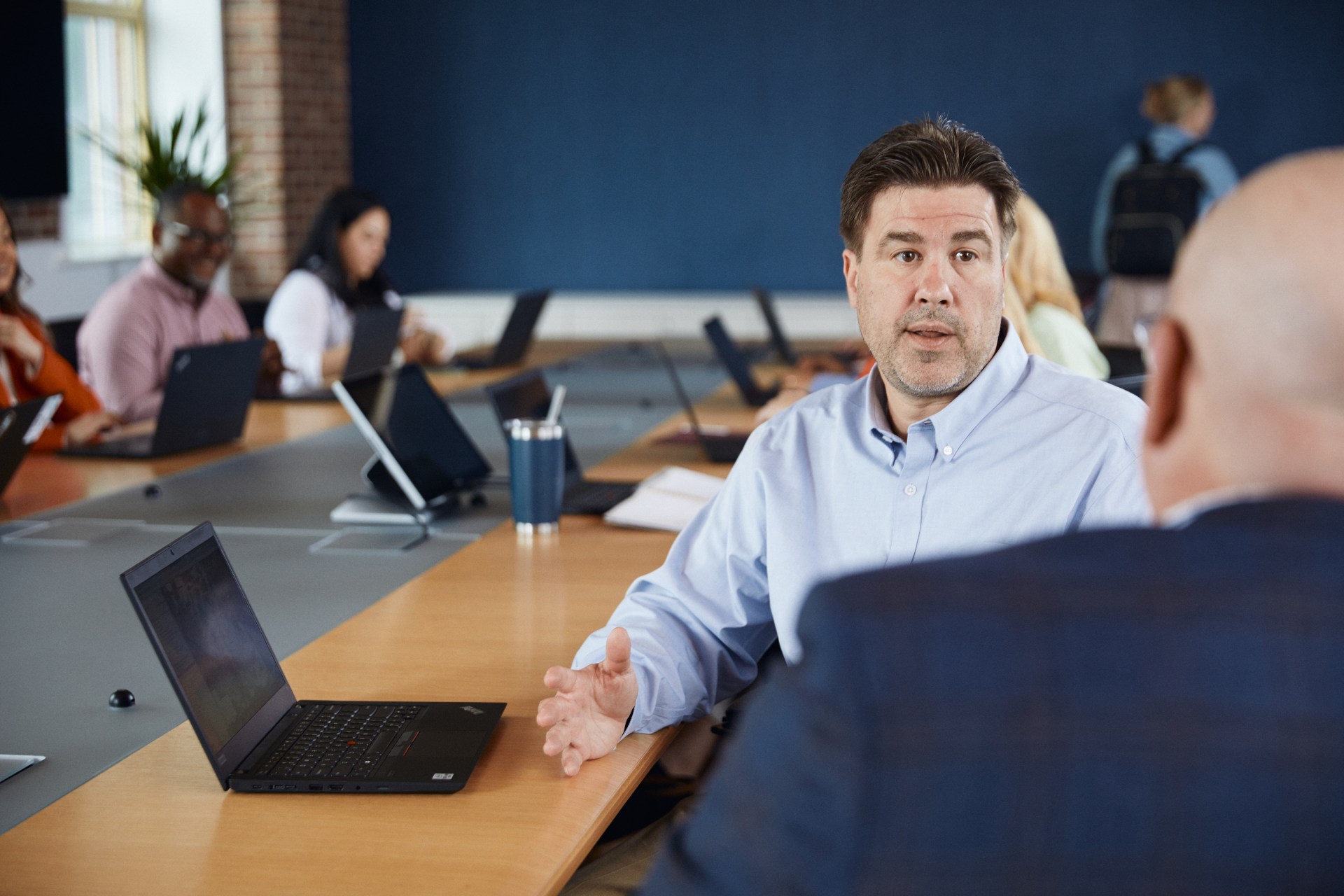 Co worker chat at meeting